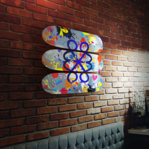 jack&lb skateboard deck triptych on a brick wall