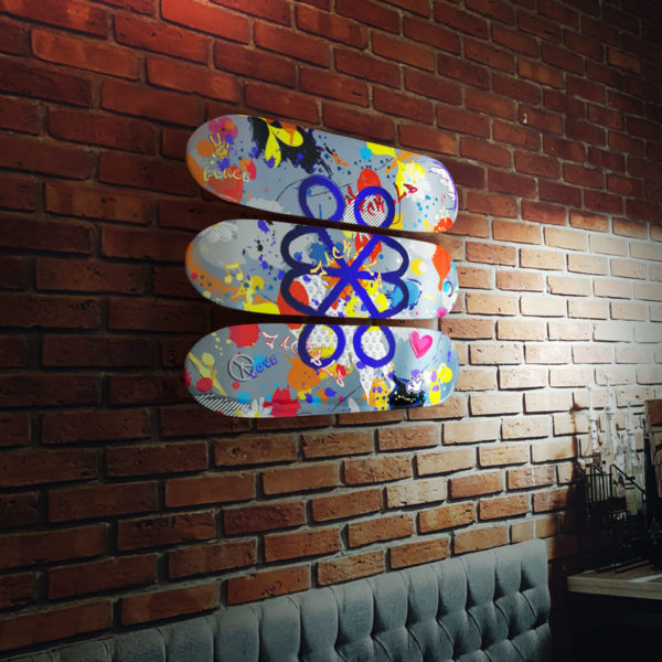 jack&lb skateboard deck triptych on a brick wall
