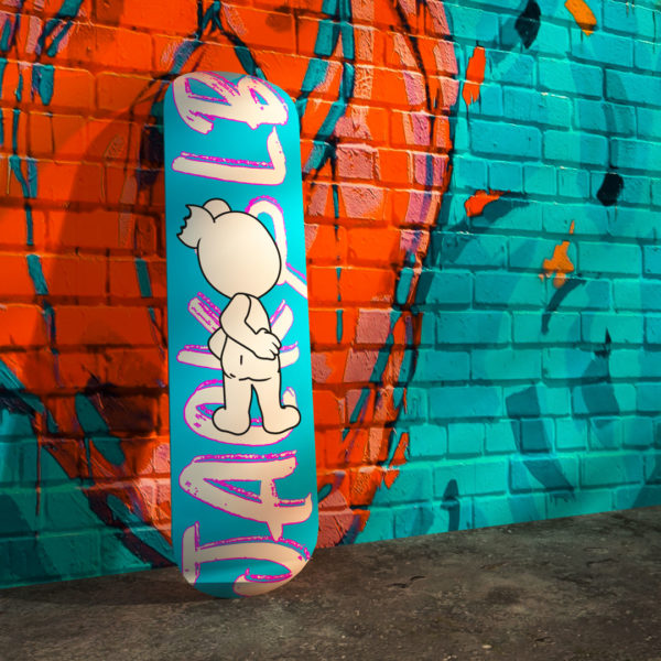 jack&lb blue skateboard against a street art wall