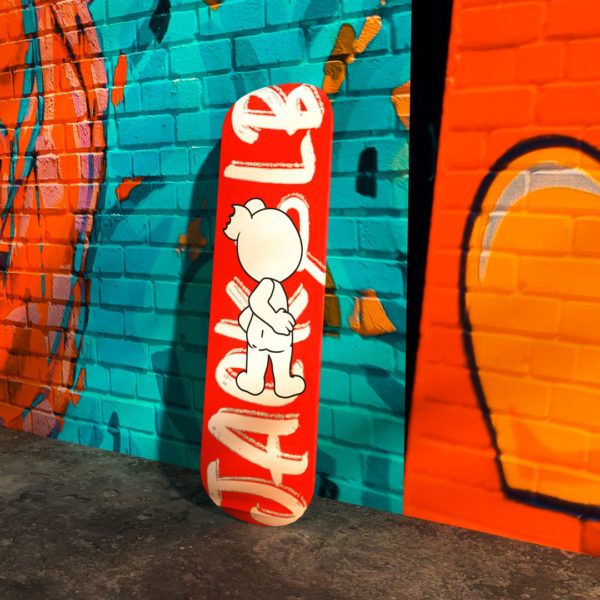 jack&lb red skateboard against a street art wall